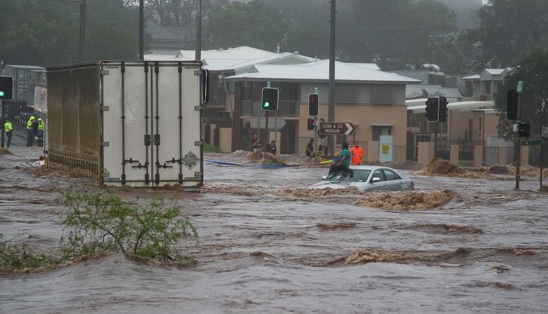 Floods threaten Brisbane, one third of Queensland declared a disaster