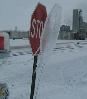 funny amazing photo of stop sign frozen to ice