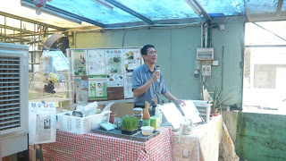 Boss giving a talk on the usage of wheats and some of the products they sold in the farm