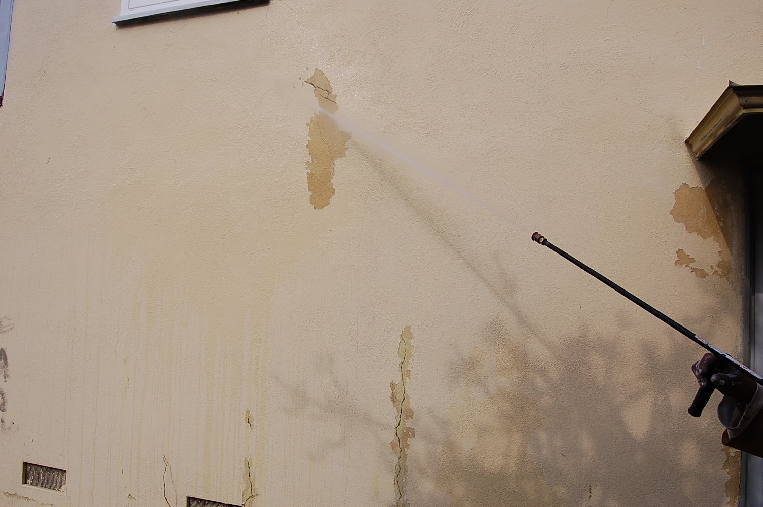 House Painting Inc. Pictures waterblastering on stucco to remove