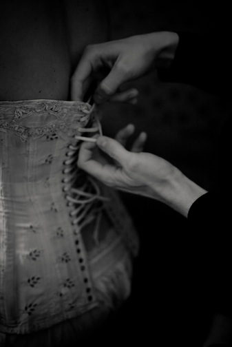 The back of a corset is laced corset pierce. The back of a corset is laced