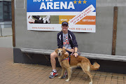 Cheetah and I in front of the sign at the arena