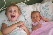 My girls, when Genesis was only several days old (September 2009)