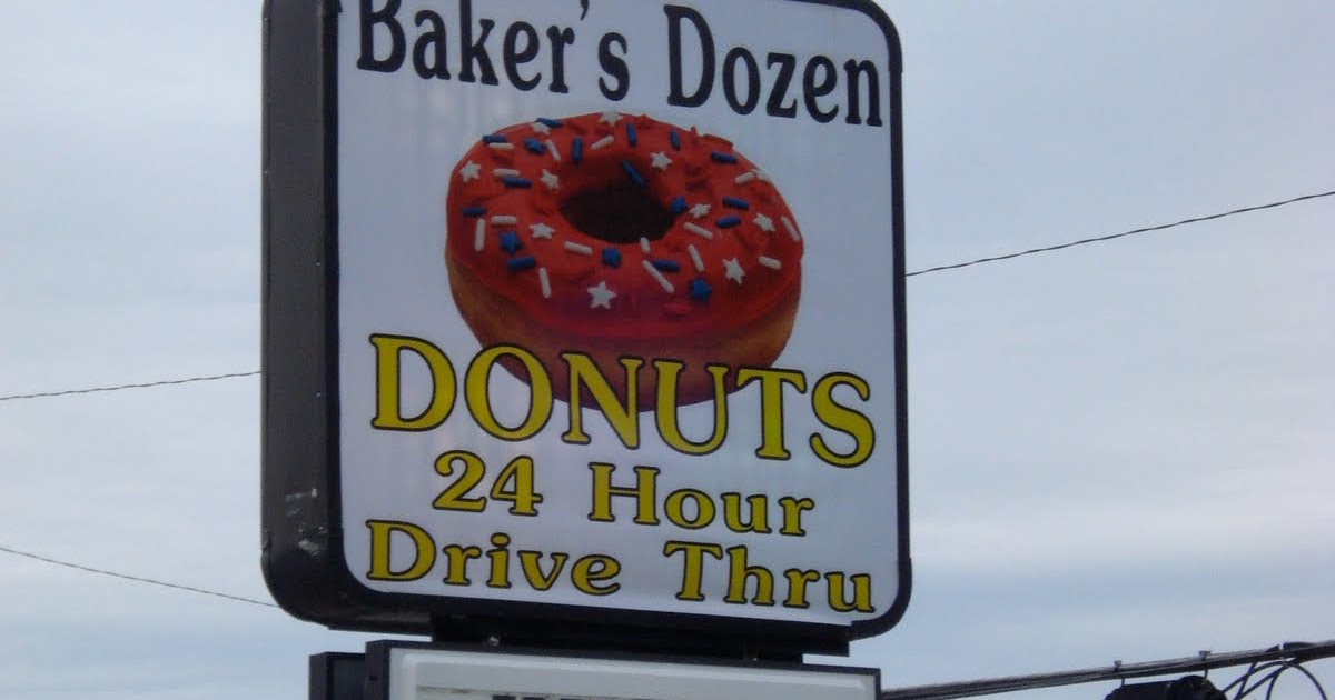 Penguin Eats Baker's Dozen Donuts Topeka, Kansas