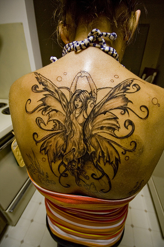 tattoos upper back. upper back tattoo