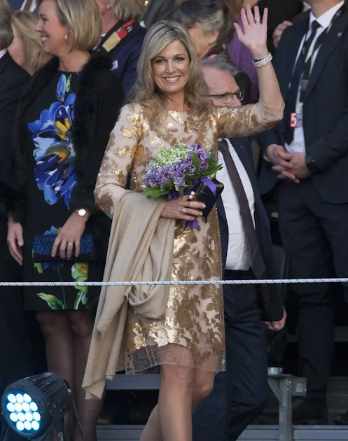 Queen Maxima and King Willem attends the Liberation Day Concert. Queen Maxima wore Jimmy Choo Tilly Metallic Pumps and Natan dress