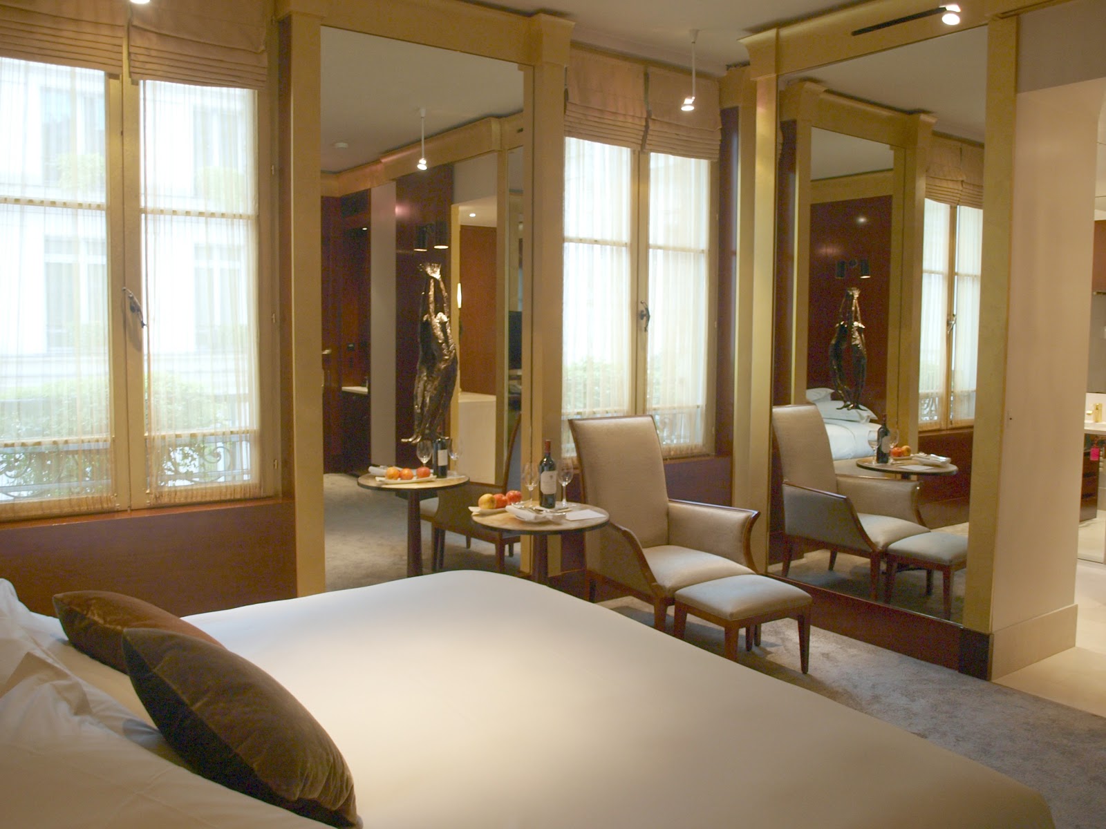 Suite with mirrored panels and French windows in Park Hyatt Paris by Hello Lovely Studio