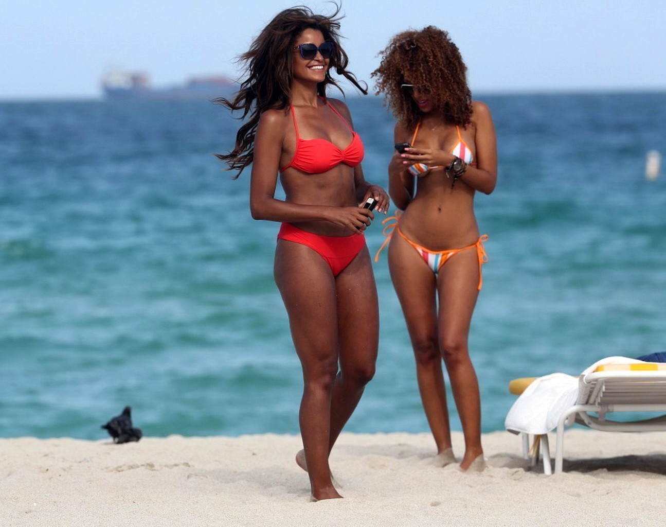 Claudia jordan showing off her bikini body on a beach in miami.