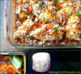 Chicken with Rice Dinner Casserole. Boneless chicken breasts, vegetables and rice cook in the oven in a flavorful broth | Recipe developed by www.BakingInATornado.com | #recipe #dinner #chicken