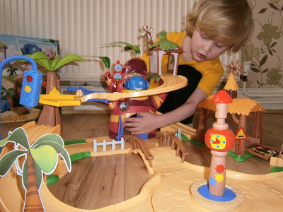 4 year old playing with jungle junction large playset from flair