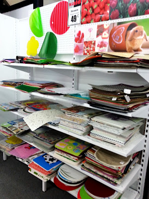 Shelves full of placemats in a discount store.