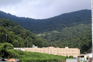 Prison against a mountain background