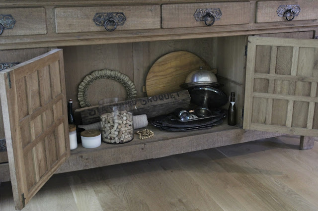 Rustic oak Belgian antique cupboard in European country styled living room by Hello Lovely Studio