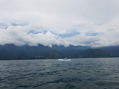person in kayak on lake atitlan guatemala