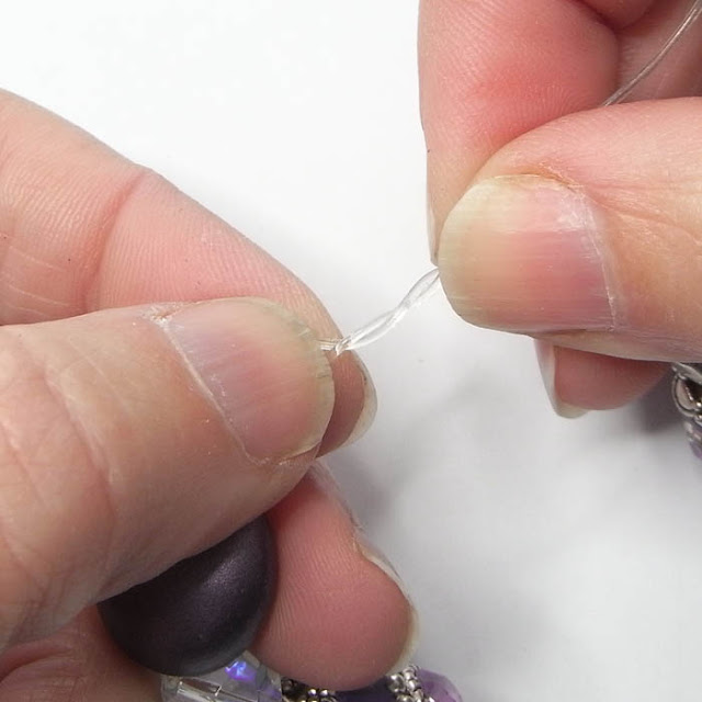 Tying a half knot in beading elastic