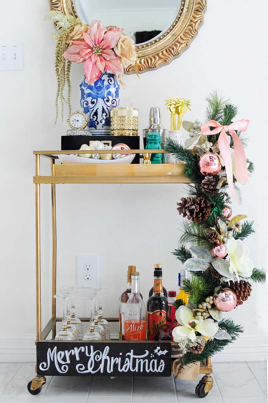Decorate your bar cart like a pro for the holidays with these simple tips and ideas. Love the blush pink and gold chinioiserie vibe!