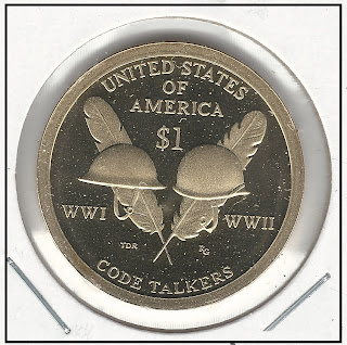 One dollar coin, tails, showing two army helmets and two eagle feathers