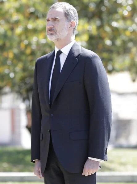 King Felipe, Queen Letizia, Princess Leonor and Infanta Sofia observed a minute's silence for victims of the coronavirus. Felipe Varela dress