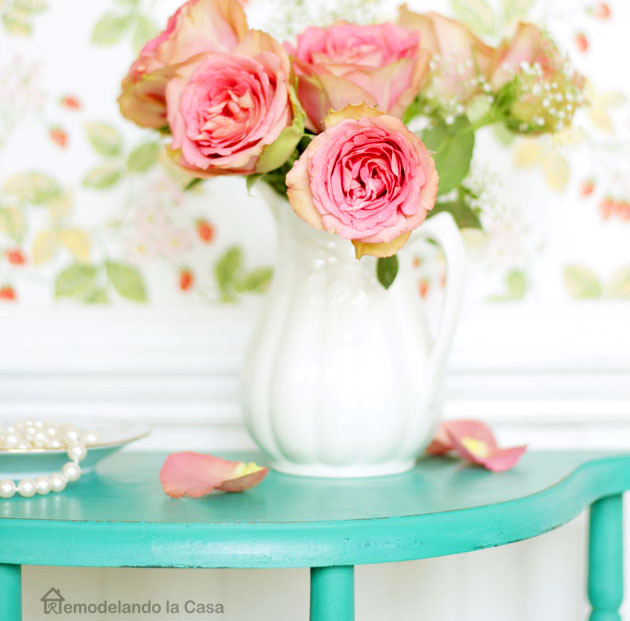 Pink roses in white pitcher, white beadboard, pearls