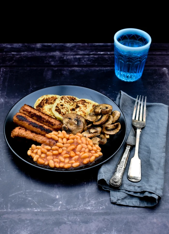 Scottish Potato Scones in a full cooked vegan breakfast with sausages, baked beans and mushrooms