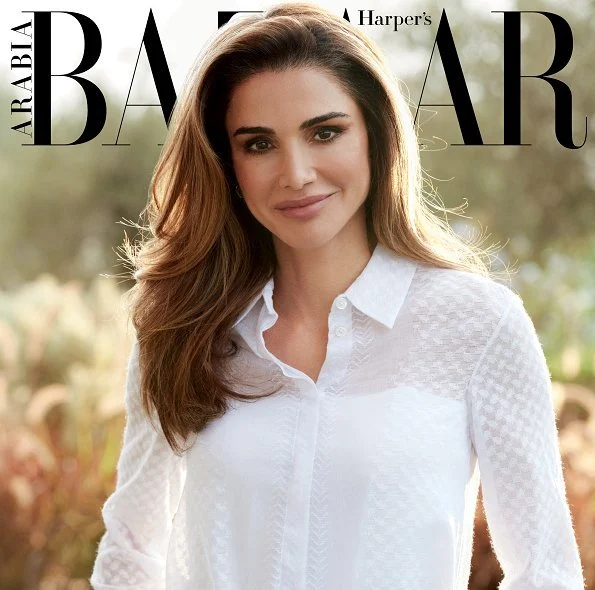 Queen Rania wore a Layeur Barbara slouch collar tie top and wide-leg trousers, and a cream jumper and skirt by Hugo Boss