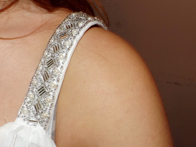 A close up of embellished top straps