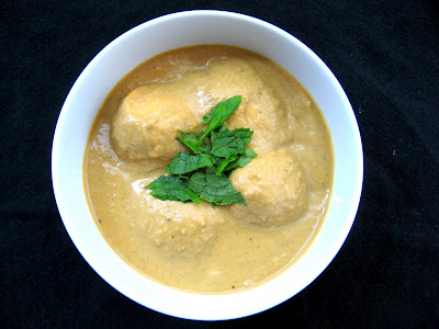 This lemongrass egg curry dish topped with fresh herbs looks delicious.