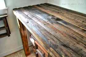 Reclaimed wood laundry room folding table by Down to Earth Style, featured on http://www.ilovethatjunk.com
