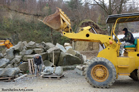 Lifting and moving stone sculpture prepare for installation Cava Nardini Vellano Tuscany Italy