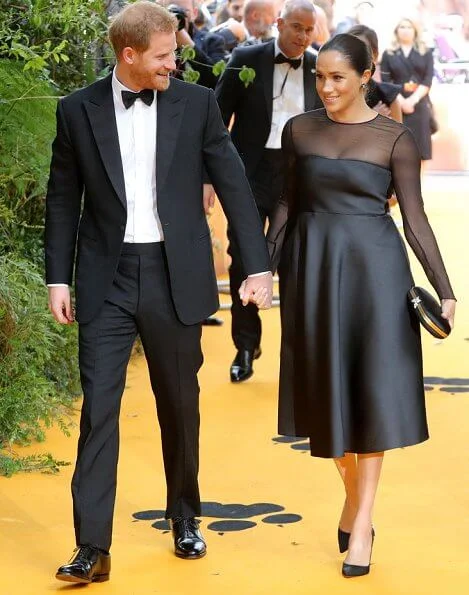 Meghan Markle wore Jason Wu Mesh panel flared dress, Aquazzura pumps,Nikos Koulis diamond earrings, Gucci clutch