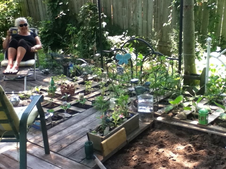 Madame Erfly S Musings Magical Gardens Wrought Iron And One Flower Bed Slopes Comfortably Like An Old Patchwork Quilt Flung On A Feather But Is Filled Instead With Flowers And Vegetables Ornate Wrought Iron