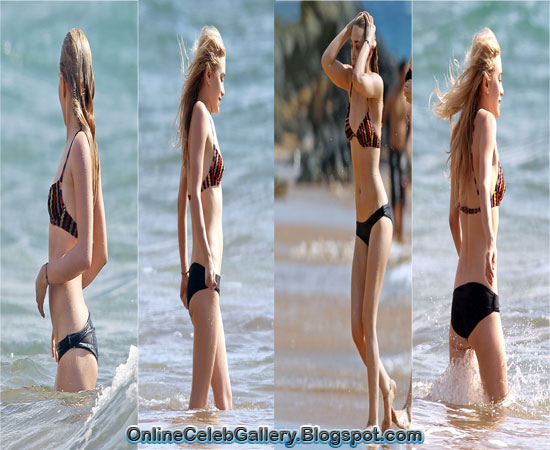 Ashley Olsen lets her guard down to flash a rare smile on bikini break in Hawaii