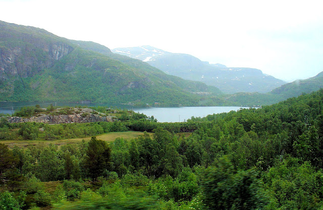 A panoramic view of Reinungvatnet mountain lake at the beginning of journey.