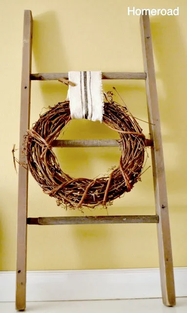 Hang a wreath from DIY grain sack ribbon on a hand made ladder