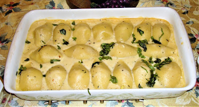 STUFFED SHELLS WITH TUNA FISH YIELD: 24 STUFFED SHELLS BECHAMEL SAUCE INGREDIENTS 2 tbsp. finely diced onions or shallots 5 tbsp. salted butter 6 tbsp. flour 6½ cups milk ¼ tsp. nutmeg 1 tsp. chopped thyme leaves METHOD Heat the oil in a frying pan and sauté the onions. Add the butter and melt. Mix in the flour and let it cook for about 3 minutes, do not let the flour to burn. Mix very often. Stir in the milk until it thickens. After milk boils add nutmeg, thyme leaves and keep on cooking for about 8 minutes at low heat.  INGREDIENTS FOR STUFFED SHELLS 1 box jumbo pasta shells #95 1 lb. cooked tuna fish. (3 cans) 1 tbsp. vegetable oil 1 minced garlic clove ½ cup chopped onions 1 diced orange pepper 6 tbsp. salted butter 7 tbsp. flour 2 cups milk 1 tbsp. grated Parmesan cheese 2 tsp. salt 1 tsp. chopped fresh thyme leaves METHOD Cook the pasta shells in a pot with salty boiling water for about 4 - 5 minutes. Cool off with cold water and set aside.   Heat the oil in a frying pan and cook garlic, onions and peppers together. Melt the butter in the frying pan and mix in the flour. Cook the flour for about 3 minutes. Whisk in the milk and it will become thick. Mix often so the flour does not burn. Add the flaked tuna fish, mix and heat well. Set aside and let cool off. Once the tuna is cold, stuff the shells and place them in a buttered baking dish. On top the shells pour the béchamel sauce and sprinkle with Parmesan cheese. Bake in a preheated oven at 350° F until stuffed shells are cooked and hot, about 20 minutes. If you wish, you can spread on top chopped fresh basil leaves before serving.