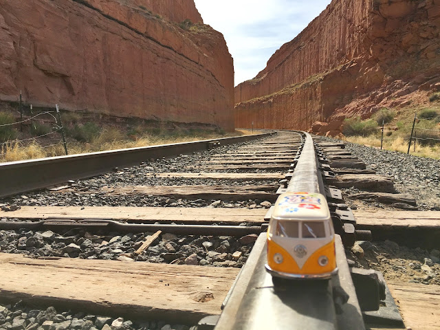 Yellow Van on railroad tracks on hiking trail