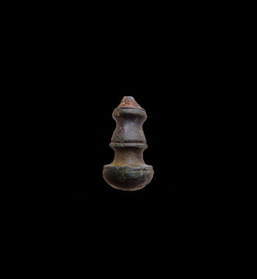 The lower baluster-shaped terminal of a linchpin from Chelmsford. 25.4mm