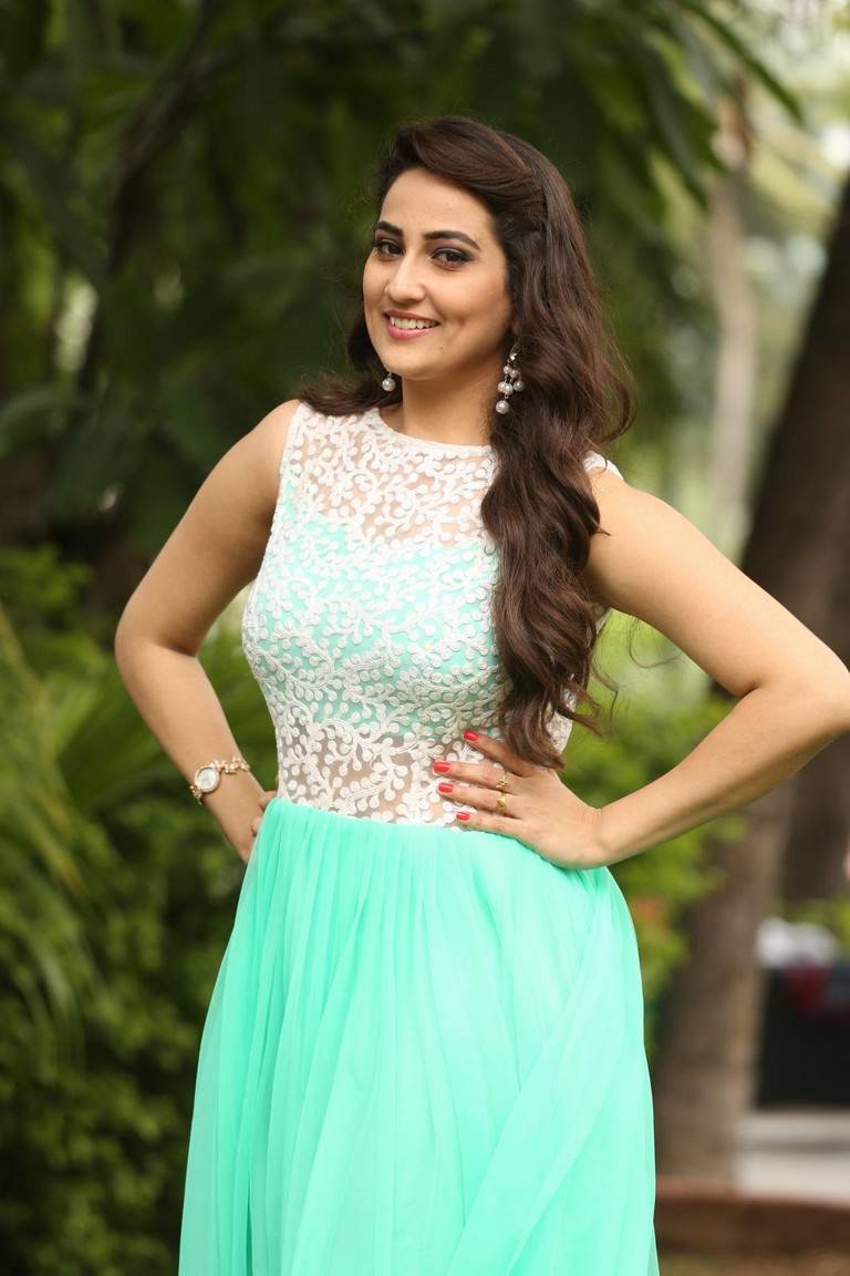 Glamours Tv Anchor Manjusha Stills At Movie Success Meet In Green Dress
