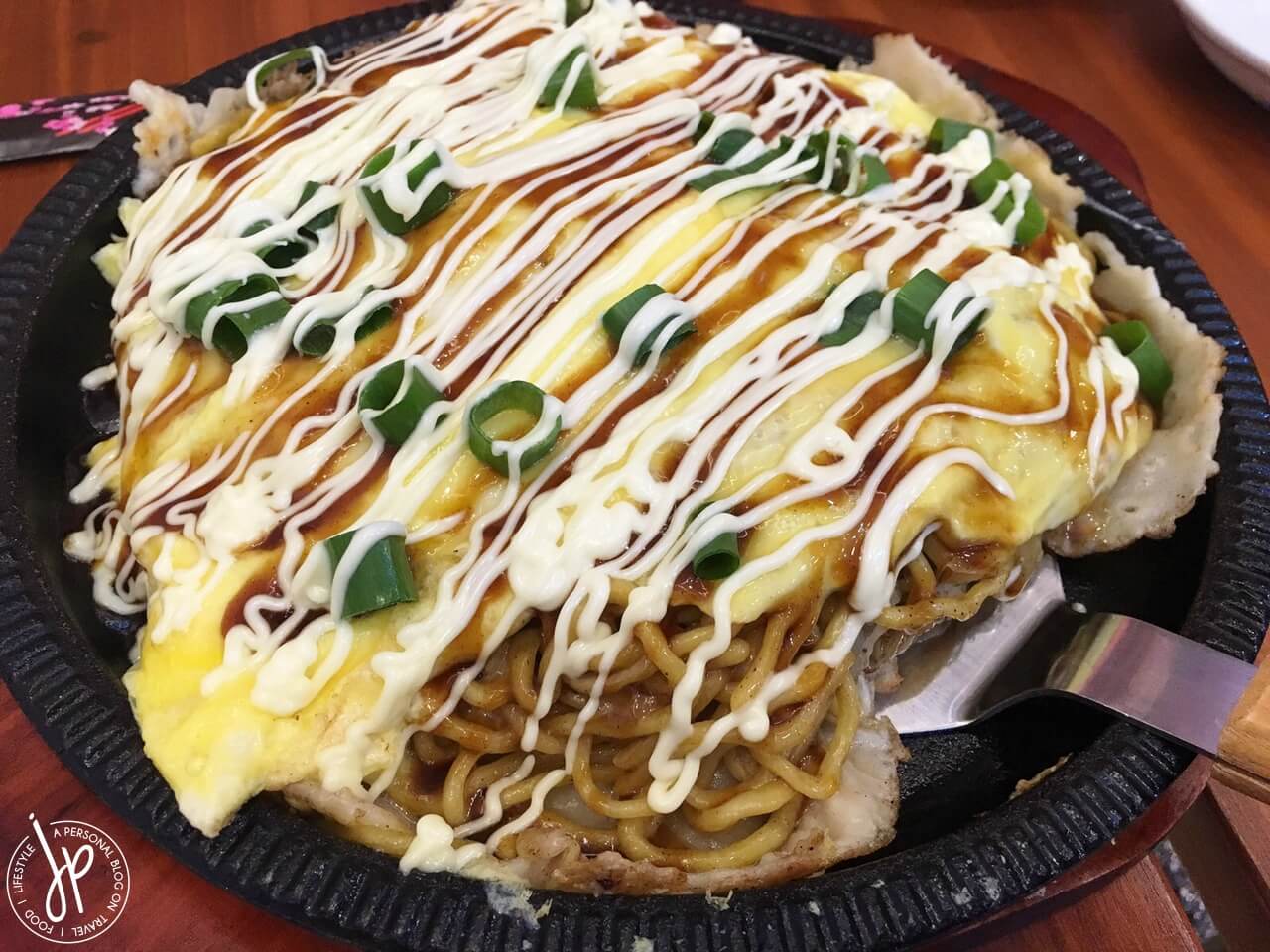 scrambled egg omelette with noodles, sauce, and mayonnaise