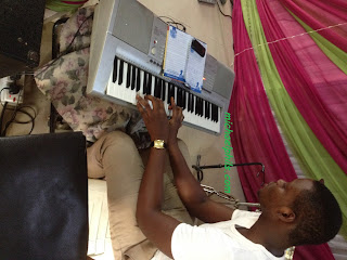 man playing what a friend we have in Jesus on the piano