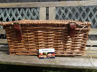hamper basket closed on bench in sunshine