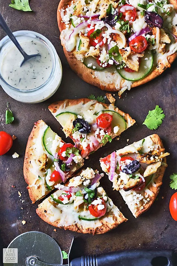 Greek Pita Pizzas and Tzatziki Sauce on a serving platter ready to eat