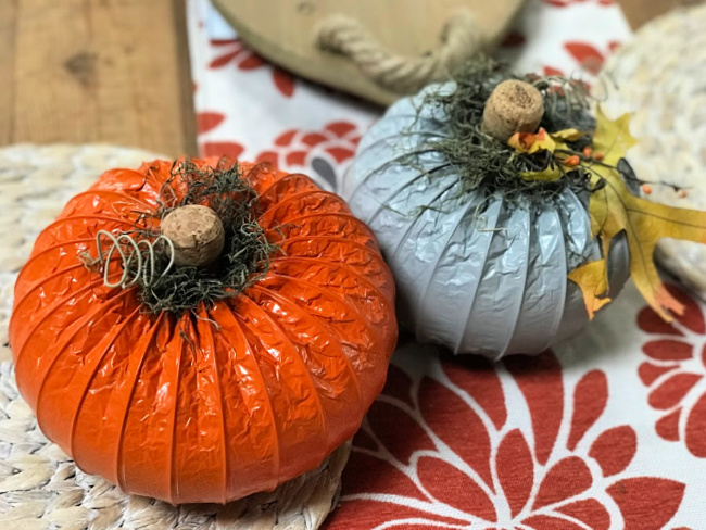 Orange and grey pumpkins made from dryer hoses