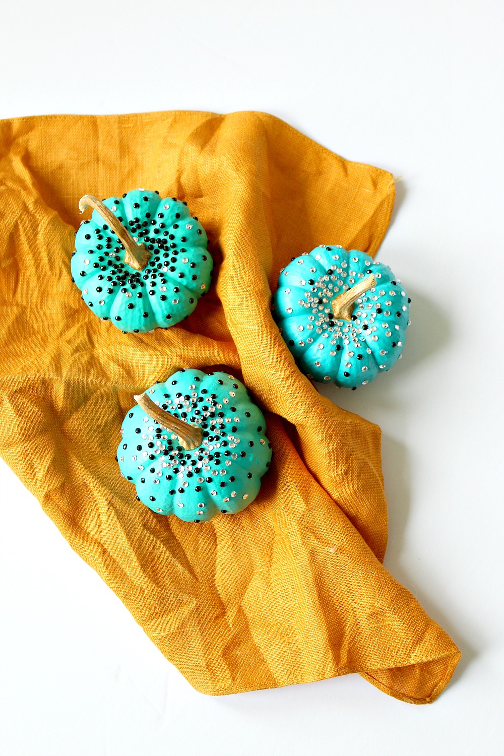 Turquoise DIY No Carve Pumpkins with Black and White Rhinestone Sparkles