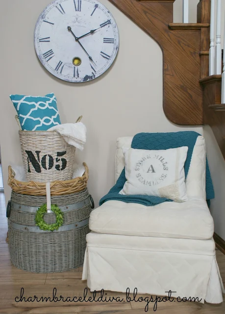 DIY stenciled basket storage for blankets and pillows