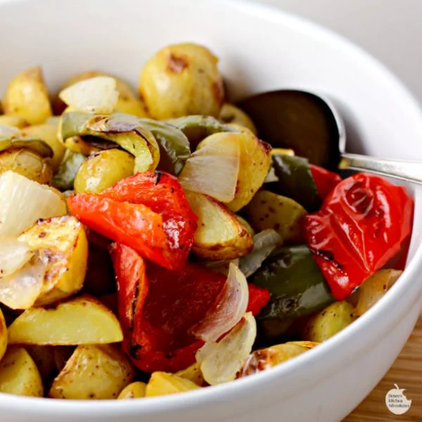 Oven Roasted Potatoes O'Brien | by Renee's Kitchen Adventures - Healthy side dish recipe perfect for breakfast, lunch or dinner!  Potatoes, peppers and onions are perfect partners in this side dish recipe! 