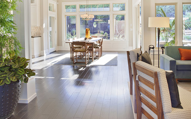 Gray wood floor adds a sense of style to this kitchen and eating area