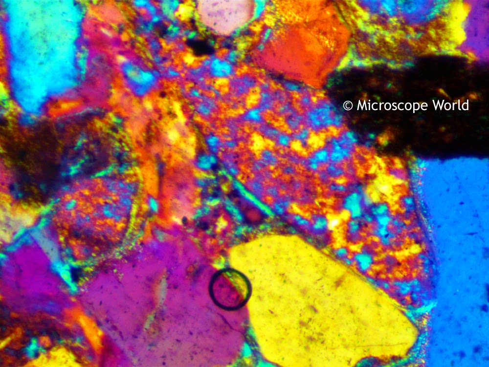 Polarizing microscope image of a thin section of rock using the full wave plate.