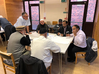 Local religious leaders talking together about the future Of Darnall
