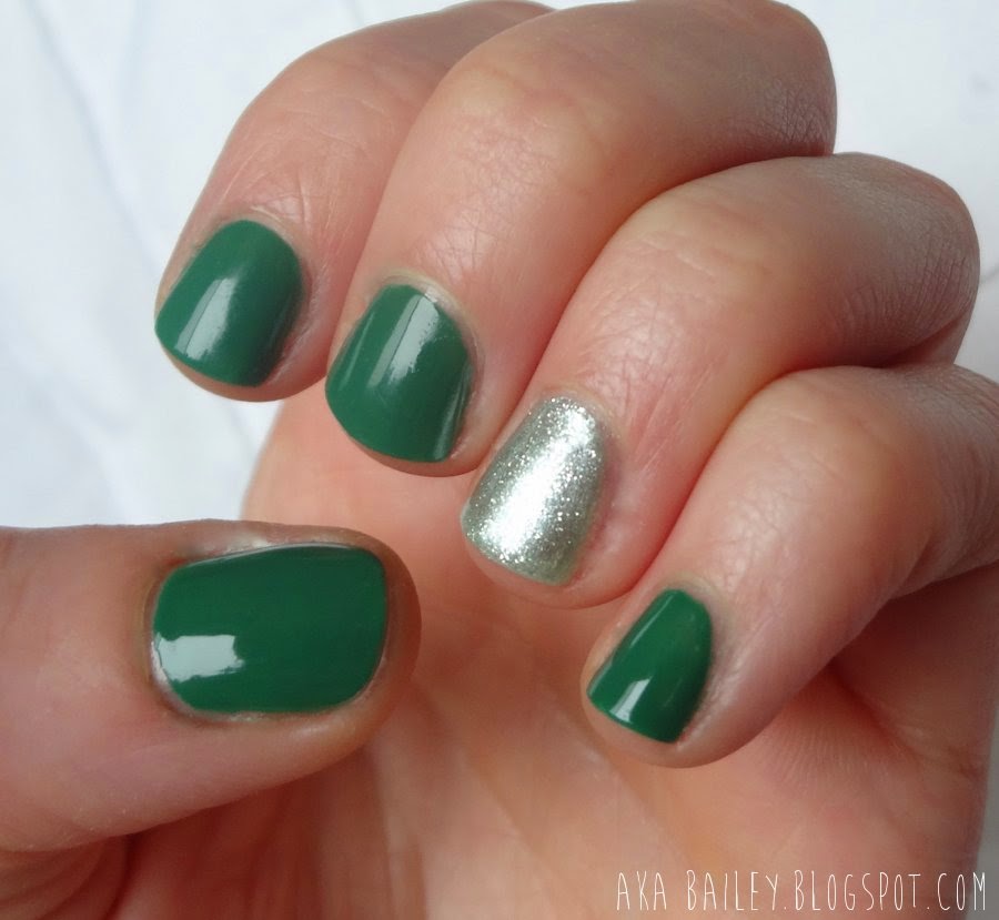 Green nails with a minty silver accent nail